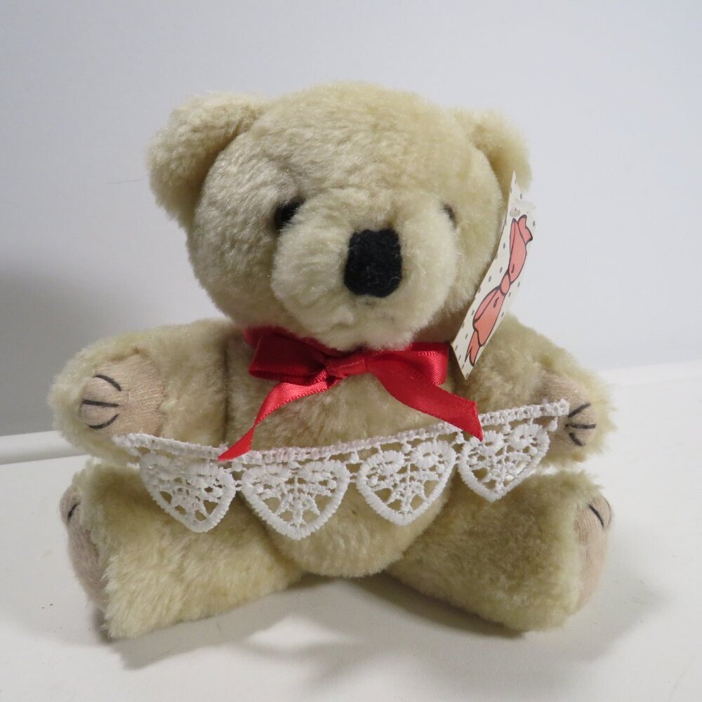 Vintage tan Teddy Bear with moveable joints with heart lace